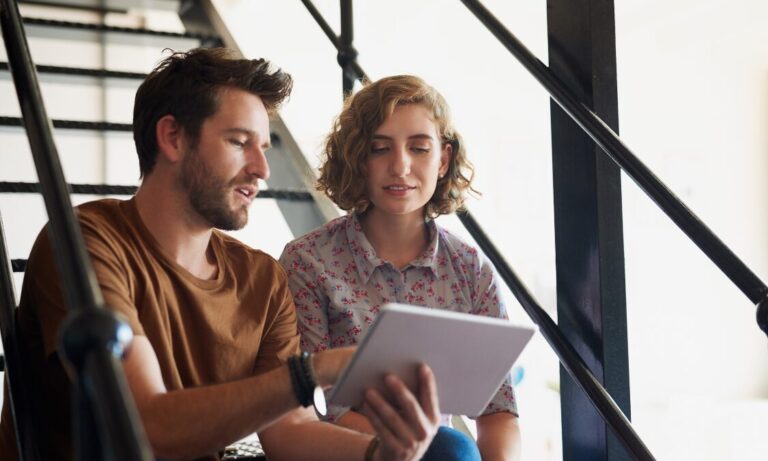 Couple reviewing property information indoors, reflecting rising buyer interest in Springfield and Broomfield following Beaulieu station connectivity improvements
