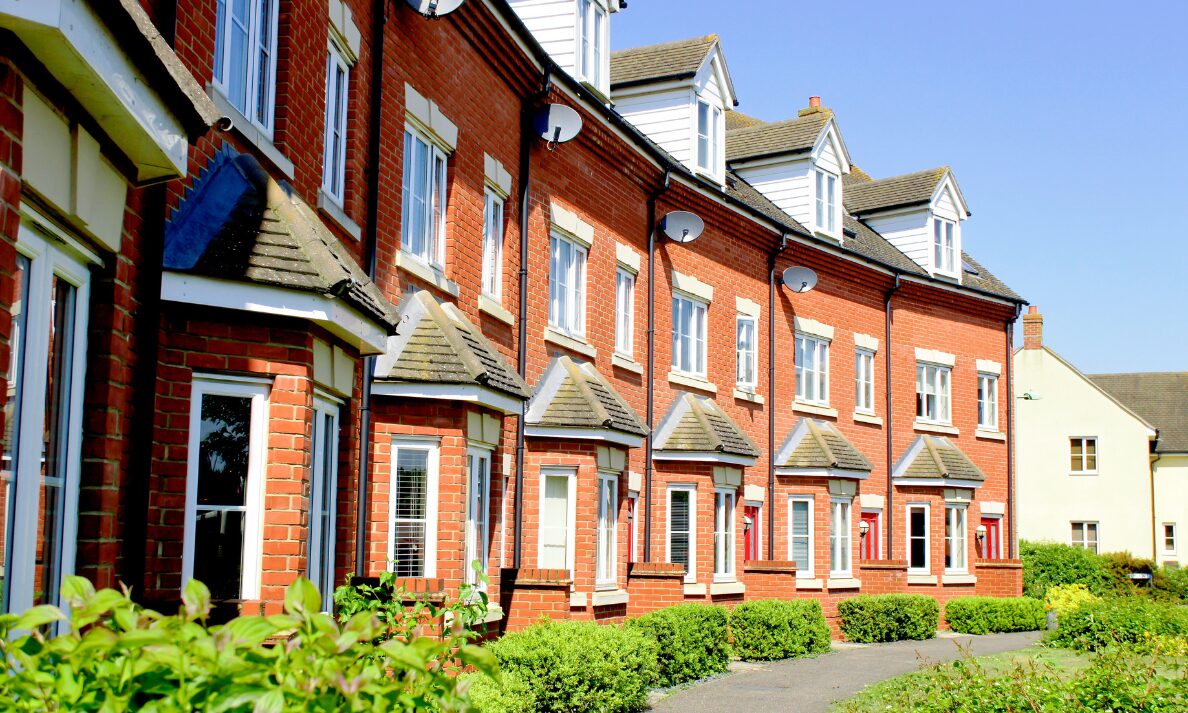 Row of modern red-brick houses, representing Chelmsford house prices and buyer demand in Beaulieu and Old Moulsham.