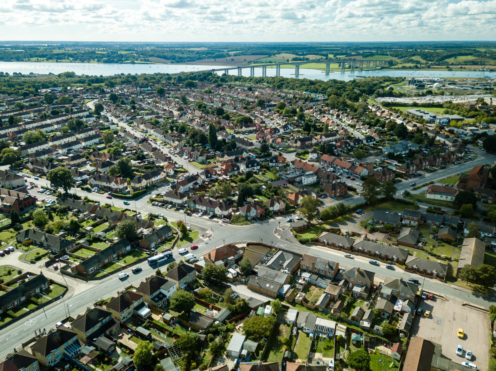 Aerial view of a residential neighbourhood near the river, representing homes and growth around Ipswich Garden Suburb.