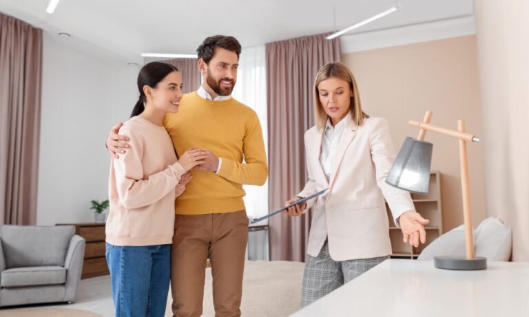 Estate agent showing a modern property to a couple during a home viewing, highlighting the buying and renting opportunities available when living in Tettenhall WV6.