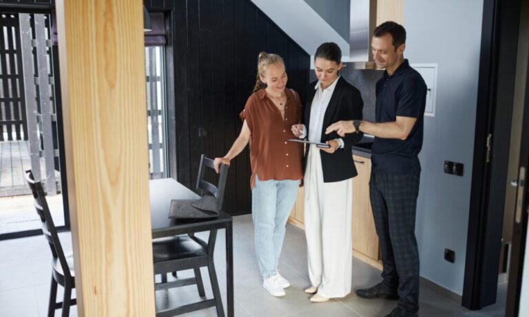 Estate agent showing a modern home to a couple during a property viewing, highlighting the buying and renting opportunities available when living in Thetford IP24.