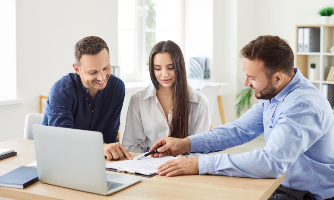 Letting agent meeting with prospective tenants or landlords to discuss rental agreements and property details, supporting an article about the Wednesbury rental market and lettings advice in WS10 for 2026.