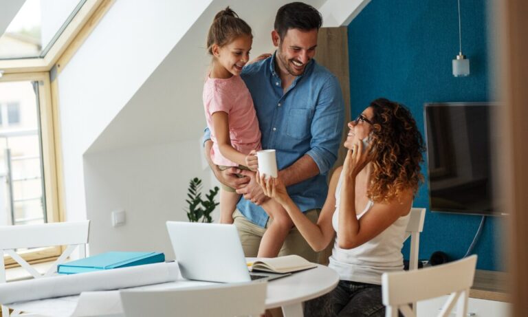 Family gathered around a table at home, representing buyers and families planning a move to Haydock WA11.